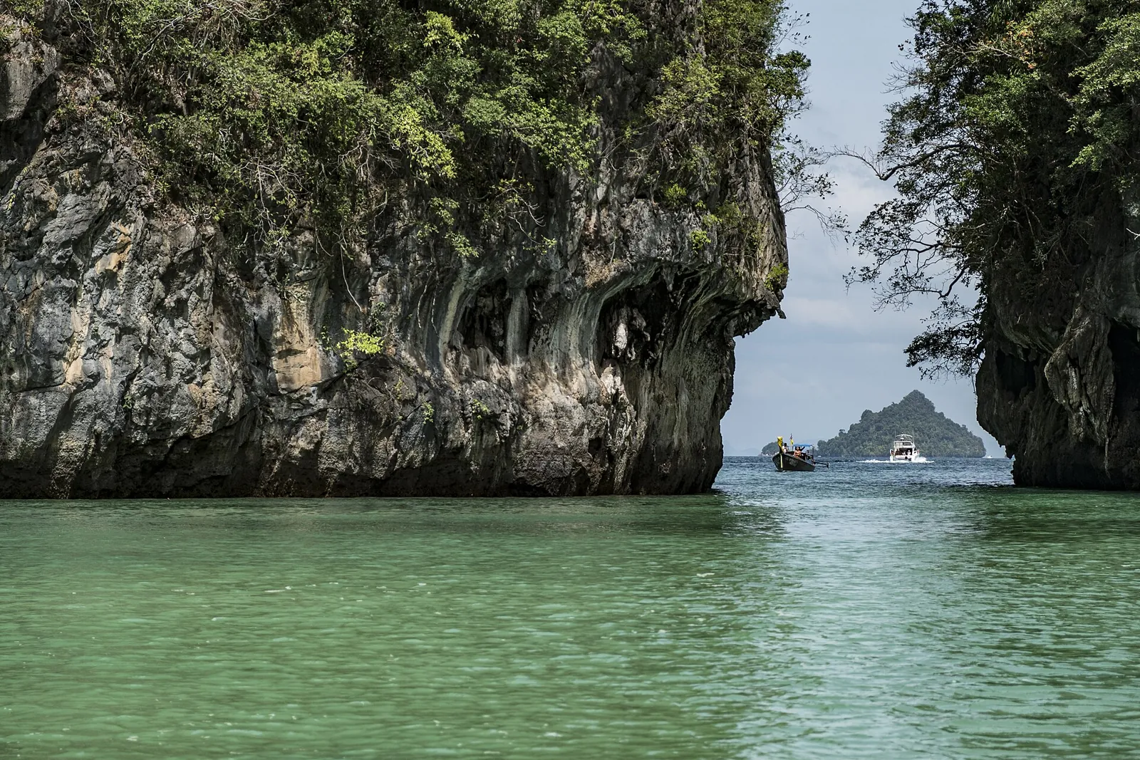 Emerald water between limestone cliffs in Hong Island lagoon, Krabi.